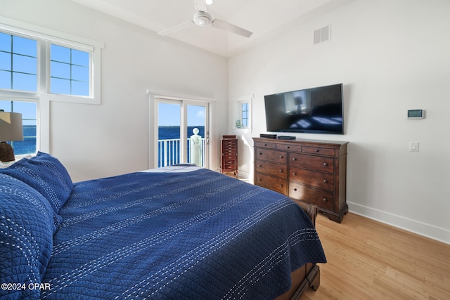 bedroom featuring ceiling fan, access to exterior, and light wood-type flooring