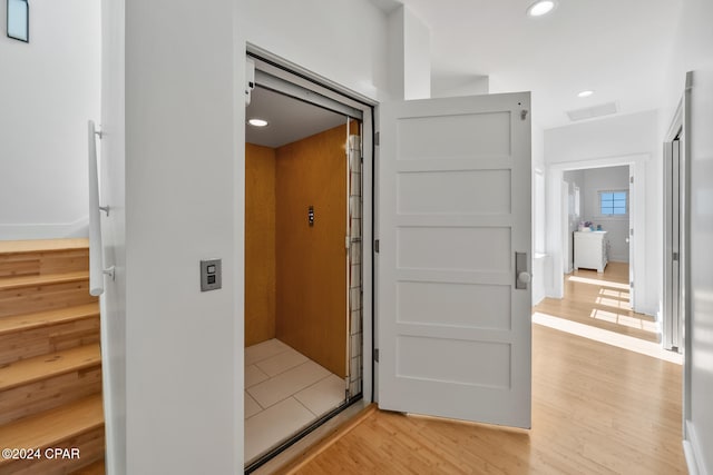 hall featuring light wood-type flooring