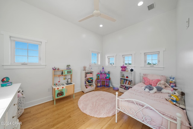 bedroom with ceiling fan and light hardwood / wood-style flooring