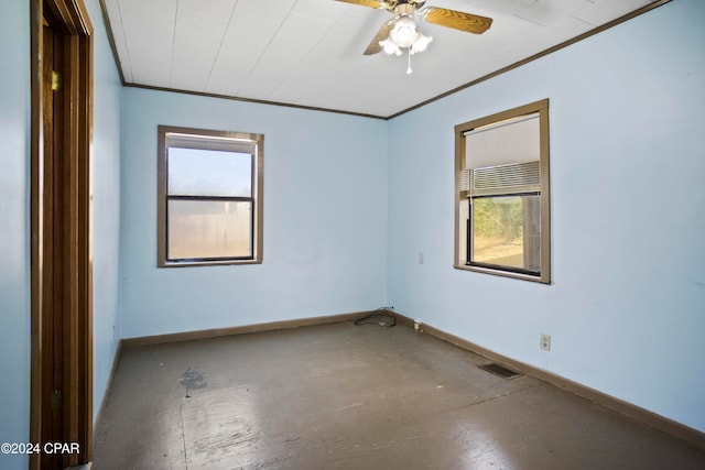 unfurnished room with a wealth of natural light, ceiling fan, and crown molding