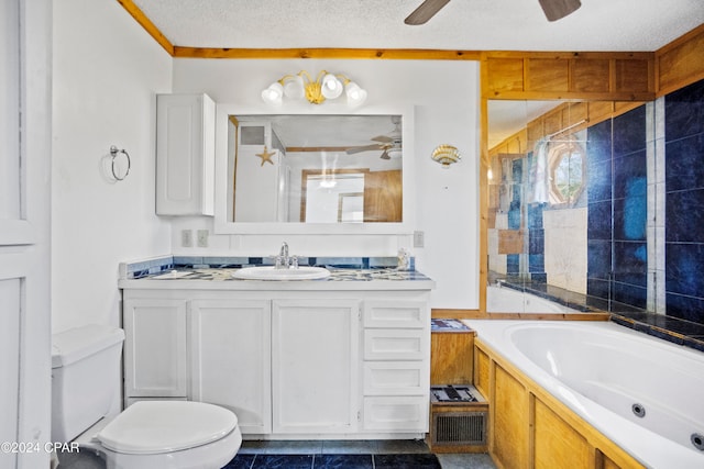 bathroom featuring tile patterned floors, toilet, a textured ceiling, a bathtub, and ceiling fan