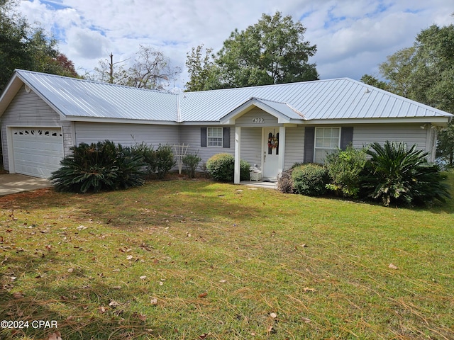 ranch-style house with a garage and a front yard