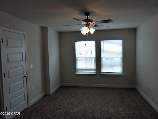 empty room featuring ceiling fan and carpet floors