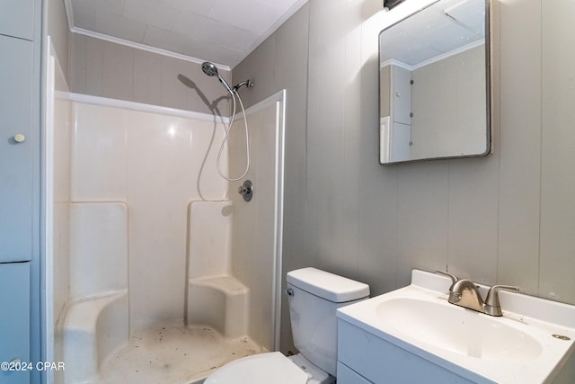 bathroom featuring walk in shower, vanity, and toilet