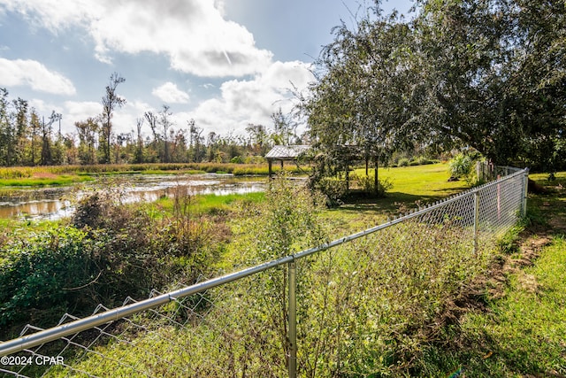 view of yard featuring a gazebo and a water view