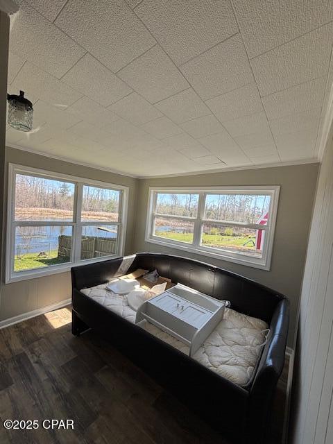 sunroom / solarium with a water view