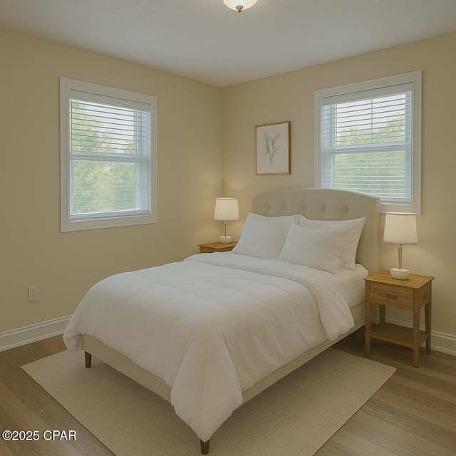 2849 Miltonia Ave, Marianna, FL 32448 - bedroom with baseboards and wood finished floors