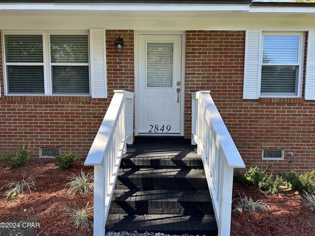2849 Miltonia Ave, Marianna, FL 32448 - entrance to property featuring crawl space and brick siding
