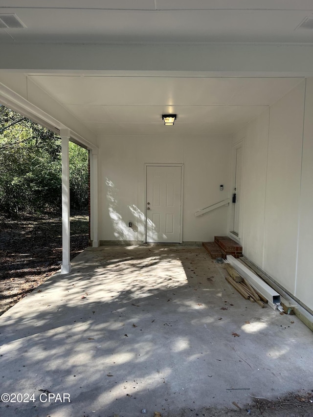 2849 Miltonia Ave, Marianna, FL 32448 - view of exterior entry with a patio and an attached carport