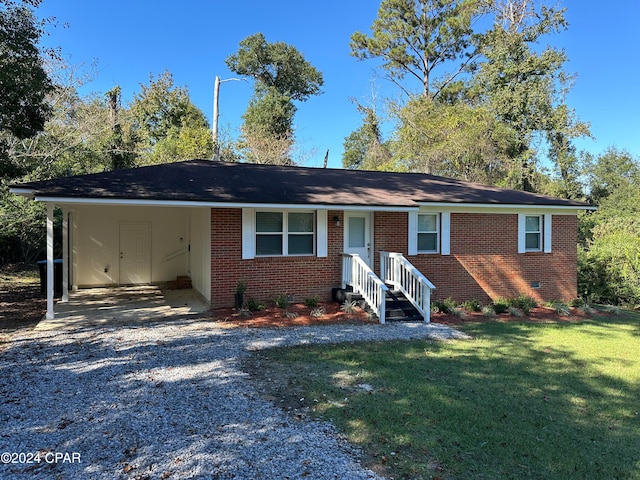 single story home featuring a front yard and a carport