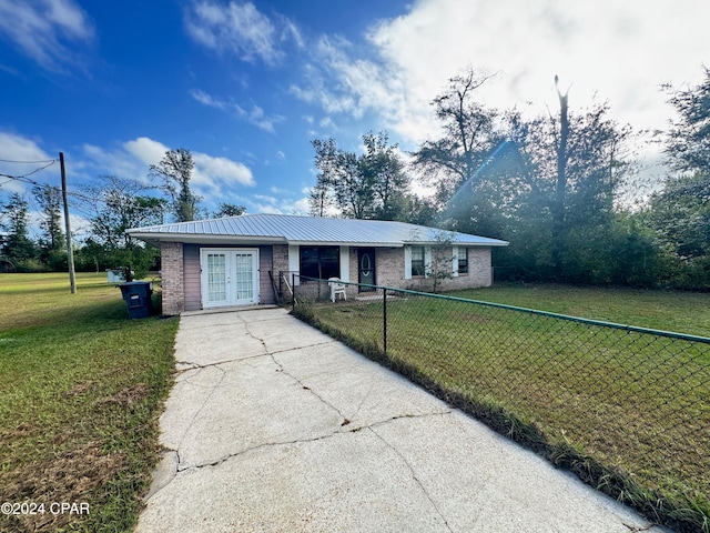 ranch-style house with a front lawn