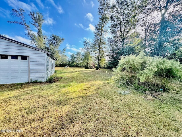 view of yard with a garage