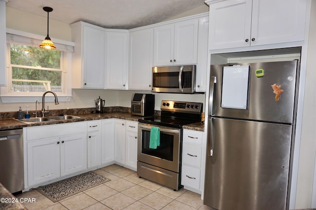 kitchen with white cabinets, sink, and appliances with stainless steel finishes