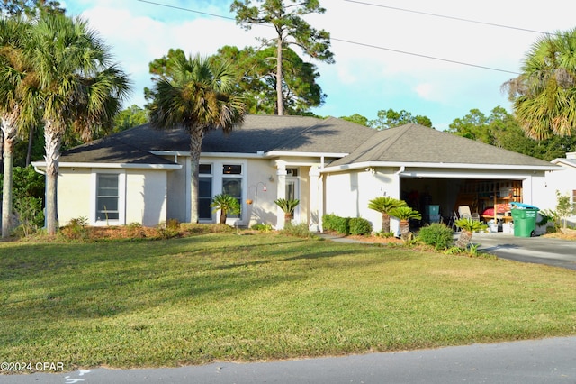 ranch-style home with a garage and a front yard