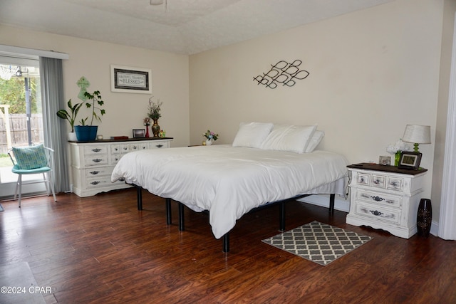 bedroom featuring dark hardwood / wood-style floors