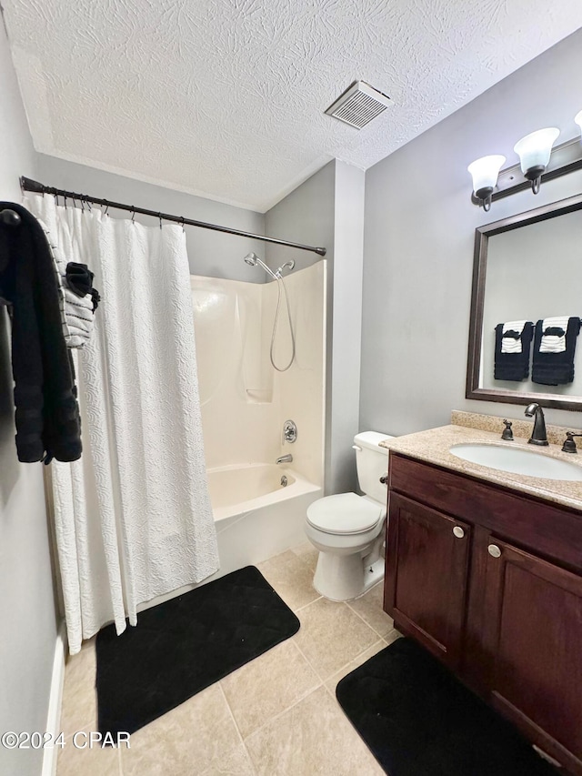 full bathroom with shower / tub combo, a textured ceiling, vanity, tile patterned flooring, and toilet