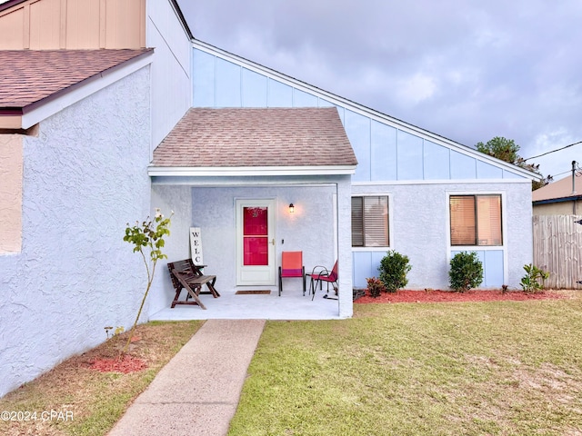 exterior space featuring a patio area and a yard