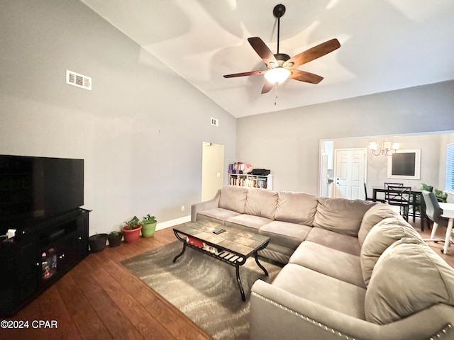 living room with ceiling fan with notable chandelier, wood-type flooring, and high vaulted ceiling