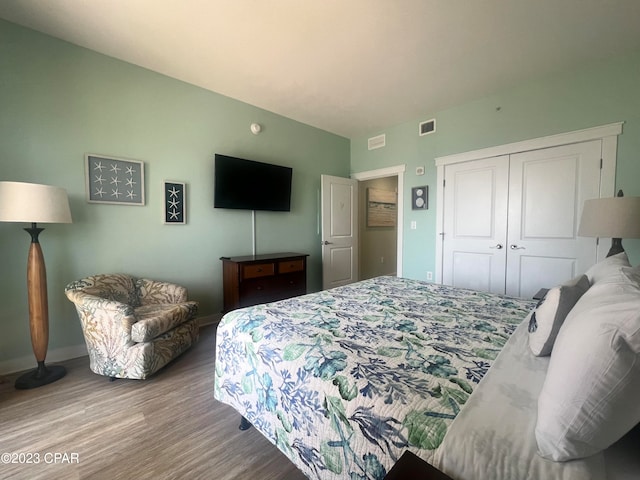 bedroom featuring a closet and light wood-type flooring