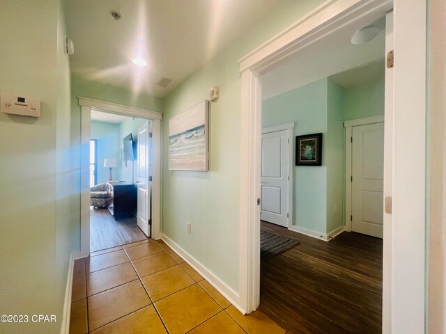 corridor featuring hardwood / wood-style floors