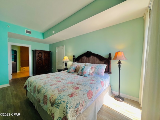 bedroom featuring dark hardwood / wood-style flooring