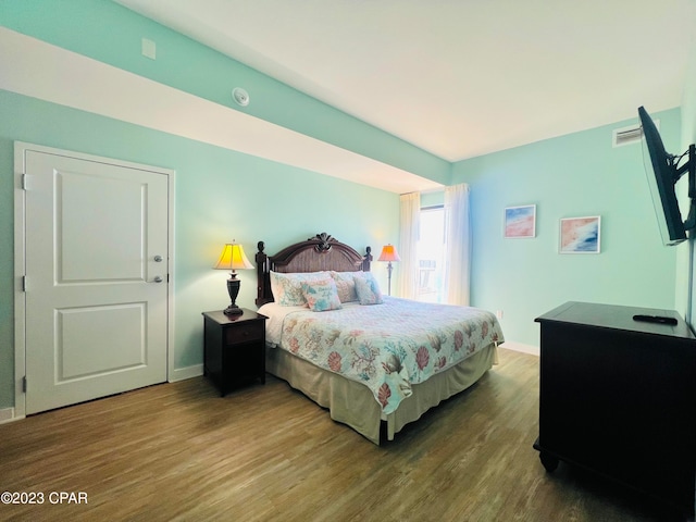 bedroom featuring hardwood / wood-style floors