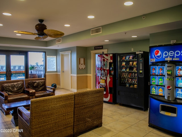 interior space with ceiling fan and french doors