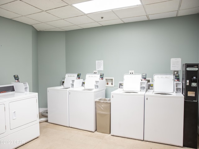 clothes washing area with washing machine and dryer