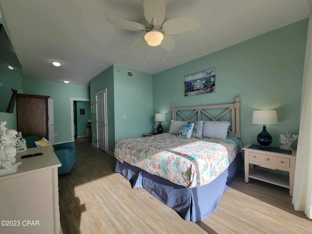 bedroom featuring a closet, ceiling fan, and hardwood / wood-style floors