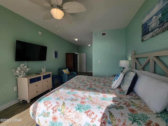 15100 Front Beach Rd Unit 1604, Panama City Beach, FL 32413 - bedroom featuring wood finished floors, vaulted ceiling, a ceiling fan, and baseboards