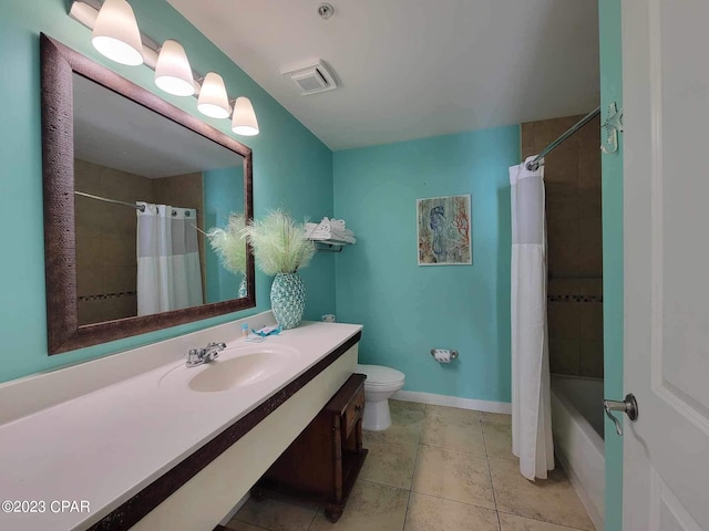 full bathroom featuring tile patterned flooring, shower / bath combination with curtain, vanity, and toilet