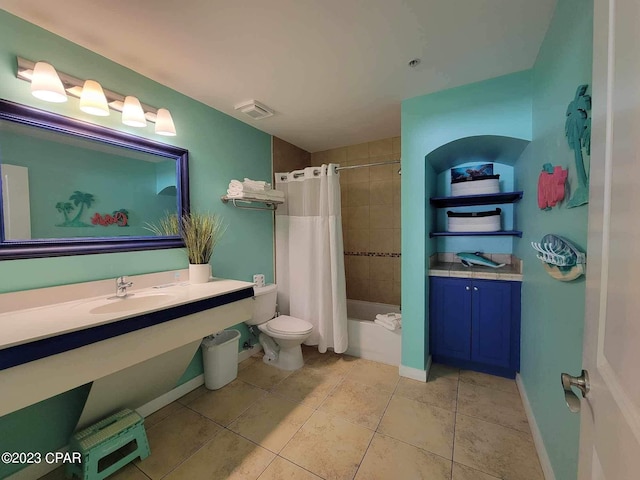 full bathroom with tile patterned floors, shower / bath combo, toilet, and sink