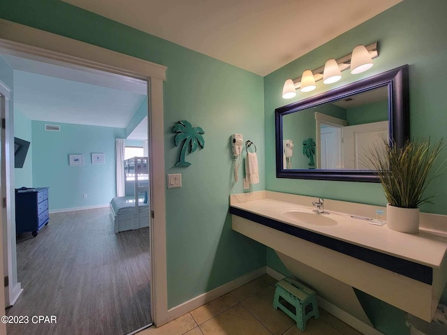 15100 Front Beach Rd Unit 1604, Panama City Beach, FL 32413 - bathroom featuring baseboards and vanity