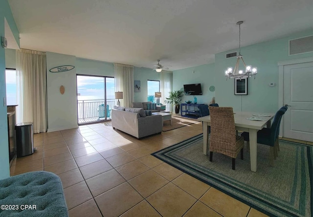 15100 Front Beach Rd Unit 1604, Panama City Beach, FL 32413 - dining room featuring a chandelier, a ceiling fan, and light tile patterned flooring