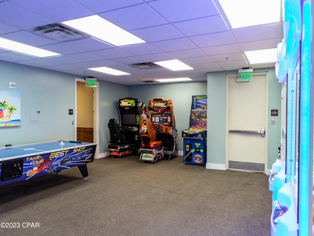 rec room featuring carpet flooring, a paneled ceiling, and electric panel