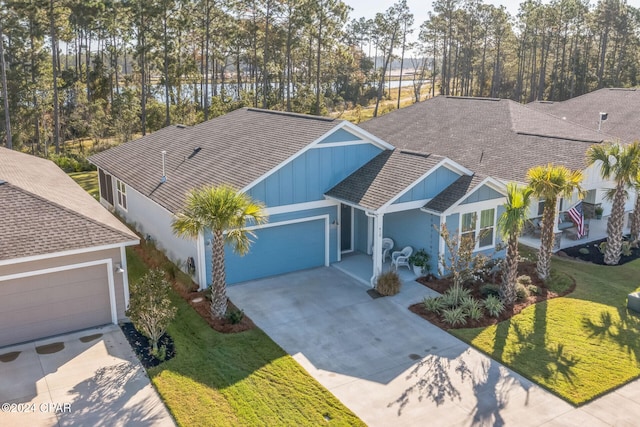 view of front of house with a front yard and a garage