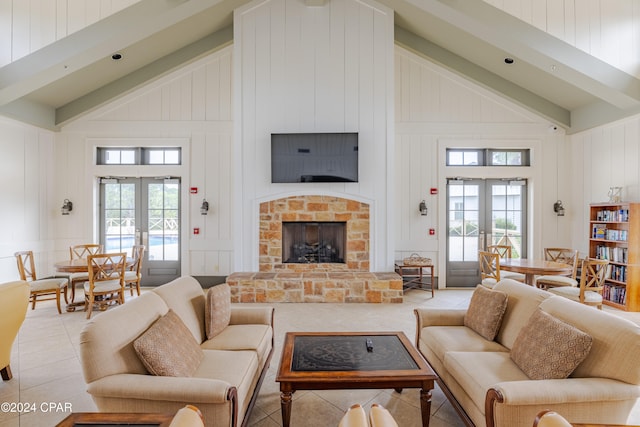 living room featuring french doors, high vaulted ceiling, light tile patterned flooring, and a brick fireplace