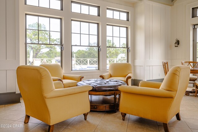 sitting room featuring light tile patterned floors and a healthy amount of sunlight