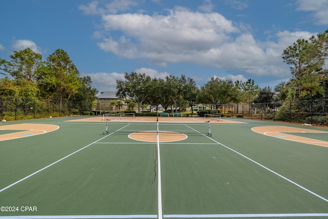 view of sport court featuring tennis court