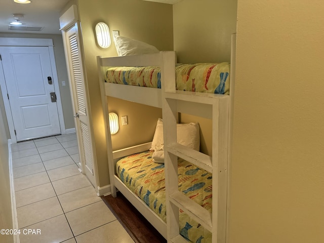 bedroom with light tile patterned flooring