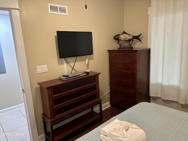 bedroom with light tile patterned flooring