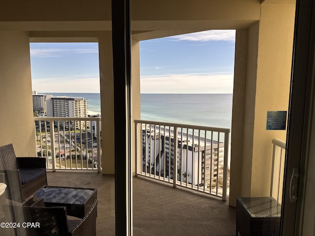 balcony featuring a water view