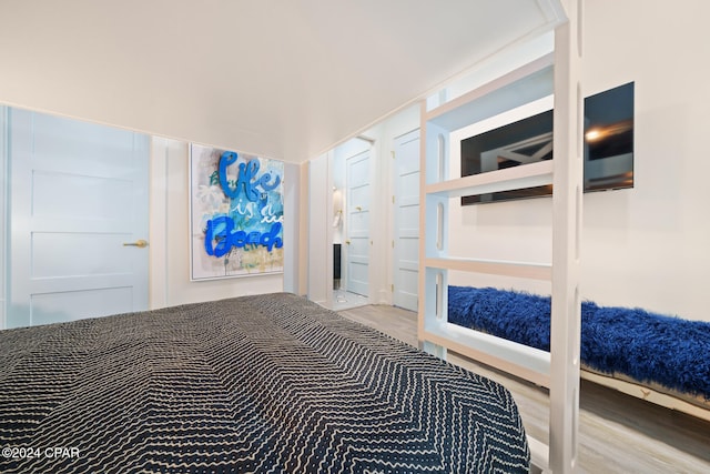 bedroom with wood-type flooring