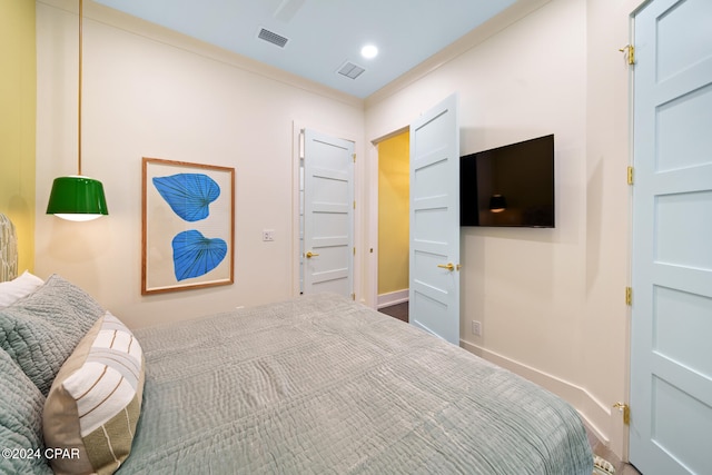 bedroom featuring ornamental molding