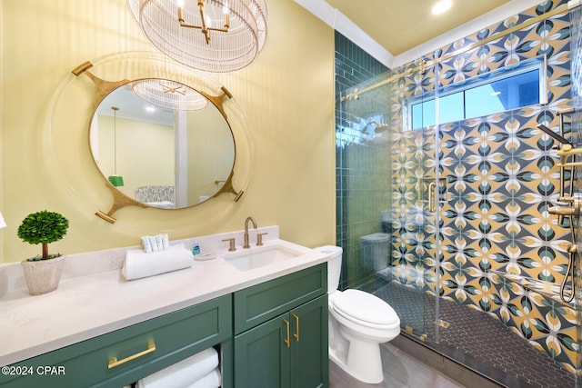 bathroom featuring toilet, vanity, and a shower with door