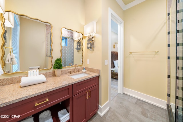 bathroom featuring ornamental molding and vanity