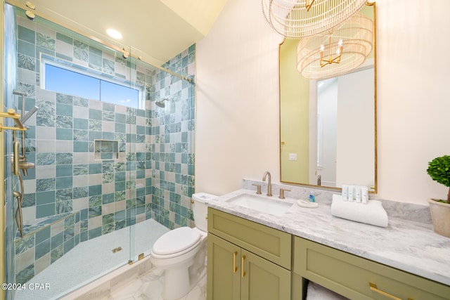 bathroom featuring a chandelier, vanity, lofted ceiling, a shower with shower door, and toilet