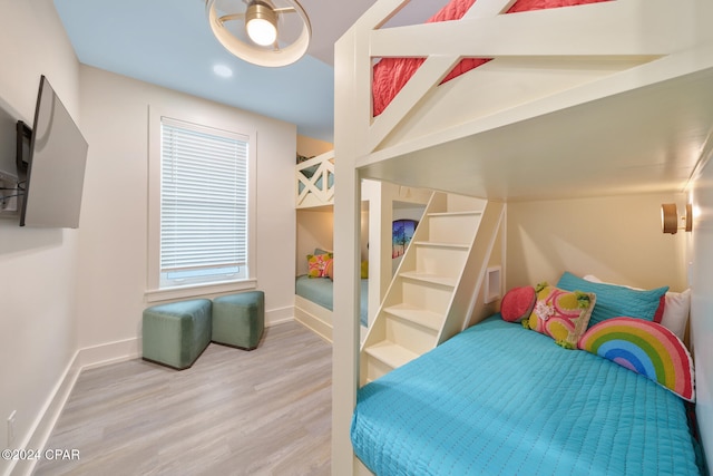 bedroom with hardwood / wood-style flooring