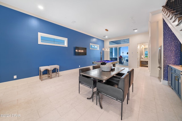 dining space featuring billiards and crown molding