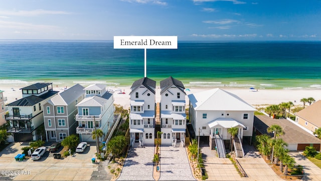 aerial view featuring a water view and a beach view